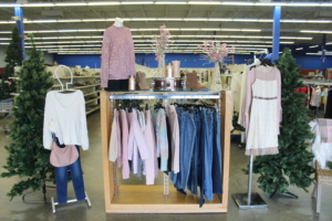 A display featuring clothing options and trees.