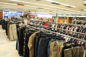 Wide view of men's clothing aisle.